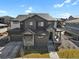 A wide shot showcasing the home's exterior, including a three-car garage and well-manicured lawn at 3422 W 155Th Ave, Broomfield, CO 80023