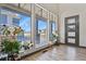 Bright foyer with large windows offering neighborhood views and stylish wood flooring at 3422 W 155Th Ave, Broomfield, CO 80023