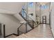 Open staircase design with sleek metal railings and large windows providing lots of natural light at 3422 W 155Th Ave, Broomfield, CO 80023