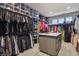 Large walk-in closet with custom shelving, hanging racks, and storage, ideal for organizing clothes and accessories at 3422 W 155Th Ave, Broomfield, CO 80023