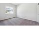 Bright room with neutral carpet and view of the outside community at 485 Interlocken Blvd # 106, Broomfield, CO 80021