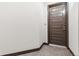 Image shows the front entry door to unit 106 in a clean, modern building at 485 Interlocken Blvd # 106, Broomfield, CO 80021