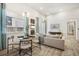 Well-lit open-concept living and dining area featuring wood flooring and contemporary decor with bright light at 485 Interlocken Blvd # 106, Broomfield, CO 80021