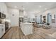 Spacious open-concept featuring a living room and kitchen with bright modern finishes and natural light at 485 Interlocken Blvd # 106, Broomfield, CO 80021