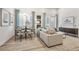 Cozy living area with modern furniture, light wood flooring, and stylish decor under bright light at 485 Interlocken Blvd # 106, Broomfield, CO 80021