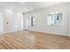 Bright living room featuring wood flooring, a sliding door, and a large window at 485 Interlocken Blvd # 106, Broomfield, CO 80021
