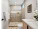 A modern bathroom featuring a glass-enclosed shower, elegant fixtures, and stylish tiling at 2326 Eliot St # 7, Denver, CO 80211