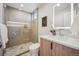 Bathroom features a glass shower enclosure, sleek vanity, and contemporary design at 2326 Eliot St # 7, Denver, CO 80211