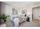 Serene bedroom with soft lighting, plush bedding, and a calming neutral color palette at 2326 Eliot St # 7, Denver, CO 80211