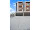 Contemporary exterior with dark garage doors and wood framed windows offers modern curb appeal at 2326 Eliot St # 7, Denver, CO 80211
