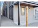 Modern exterior with metal siding and covered entrance with stone landscaping at 2326 Eliot St # 7, Denver, CO 80211