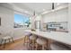 Modern kitchen with white countertops, wood cabinets, and stainless steel appliances and pendant lighting at 2326 Eliot St # 7, Denver, CO 80211