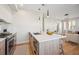 Kitchen with stylish island, stainless steel appliances, and sleek design at 2326 Eliot St # 7, Denver, CO 80211