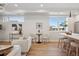 Stylish living room with hardwood floors, modern decor, and bright natural light from the windows at 2326 Eliot St # 7, Denver, CO 80211