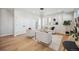 Bright and airy living room with an open layout, modern lighting, and stylish furniture at 2326 Eliot St # 7, Denver, CO 80211