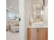 A stylish powder room with a vessel sink, wood vanity, pendant lighting, and modern finishes at 2326 Eliot St # 7, Denver, CO 80211