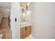 Modern powder room with a stylish vanity, pendant lights, and contemporary fixtures at 2326 Eliot St # 7, Denver, CO 80211