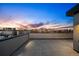 A rooftop deck with skyline views offers a modern and inviting outdoor retreat at 2326 Eliot St # 7, Denver, CO 80211