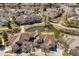 Birds eye view showcasing the patio homes, landscaping, and a pond for the community at 6024 W Colorado Ln, Lakewood, CO 80232