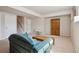 Finished basement with carpeted floors, staircase and storage at 6024 W Colorado Ln, Lakewood, CO 80232