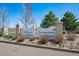 Attractive community entrance sign reads 'Wildflower Patio Homes' and 'Summerfield Townhomes' with manicured landscaping at 6024 W Colorado Ln, Lakewood, CO 80232