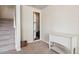 Carpeted hallway with storage closet and staircase at 6024 W Colorado Ln, Lakewood, CO 80232