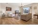 Cozy living room featuring hardwood floors, natural light, and traditional furnishings at 6024 W Colorado Ln, Lakewood, CO 80232