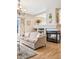 Living room boasts a fireplace, built-in shelves, and a comfortable sofa at 6024 W Colorado Ln, Lakewood, CO 80232