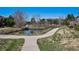 Walking paths around a scenic pond in a residential community at 6024 W Colorado Ln, Lakewood, CO 80232