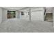 Large basement space featuring neutral-colored walls and carpet, large window, and stair access at 9371 Princeton Ln, Highlands Ranch, CO 80130