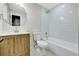 Updated bathroom features a modern vanity, toilet, bathtub, and updated fixtures at 9371 Princeton Ln, Highlands Ranch, CO 80130