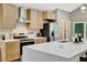 Beautiful kitchen featuring stone counter tops, stainless appliances, and sleek light wood cabinetry at 9371 Princeton Ln, Highlands Ranch, CO 80130