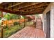 The covered outdoor patio features brick flooring and leads to a fenced yard at 9371 Princeton Ln, Highlands Ranch, CO 80130