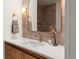 Bathroom with a marble countertop, modern fixtures, and stylish mirror at 1 Winged Foot Way, Littleton, CO 80123