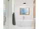 Bright bathroom featuring modern tub under a window at 1 Winged Foot Way, Littleton, CO 80123