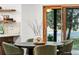 Dining area with a round table, seating for four, and a sliding door to the backyard at 1 Winged Foot Way, Littleton, CO 80123