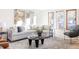 Cozy living room featuring a large sectional sofa, decorative pillows, and a round coffee table on an area rug at 1 Winged Foot Way, Littleton, CO 80123