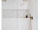 Modern shower with brass fixtures and a built-in shelf at 1 Winged Foot Way, Littleton, CO 80123