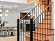 Open staircase, dining area, and kitchen with granite countertops are visible in the background at 1 Winged Foot Way, Littleton, CO 80123