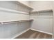 Large walk-in closet with custom shelving and hanging rods at 16850 Mckay Dr, Mead, CO 80542