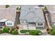 Aerial view of a home with a patio, backyard and a well-manicured lawn at 11193 Mission Walk St, Parker, CO 80134