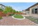 Landscaped backyard boasts an artificial lawn area with decorative rock and patio, perfect for outdoor enjoyment at 11193 Mission Walk St, Parker, CO 80134