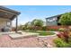 Expansive backyard features an elegant patio, rock garden, and vibrant landscaping at 11193 Mission Walk St, Parker, CO 80134