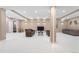 Spacious basement featuring modern lighting, neutral walls, and sleek couches, creating a cozy entertainment area at 11193 Mission Walk St, Parker, CO 80134