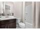 This is a bathroom with a shower, toilet and sink at 11193 Mission Walk St, Parker, CO 80134
