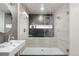 This bathroom boasts a glass enclosed shower stall and a modern sink at 11193 Mission Walk St, Parker, CO 80134