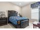 Well-lit bedroom features large window, dark wood furnishings, and refined accents at 11193 Mission Walk St, Parker, CO 80134