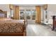 Bedroom with a queen sized bed, decorative headboard, and bright window views at 11193 Mission Walk St, Parker, CO 80134