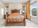 Comfortable bedroom featuring a bed with decorative headboard and side tables at 11193 Mission Walk St, Parker, CO 80134