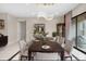 Bright dining room with a long table set for eight under an elegant chandelier at 11193 Mission Walk St, Parker, CO 80134